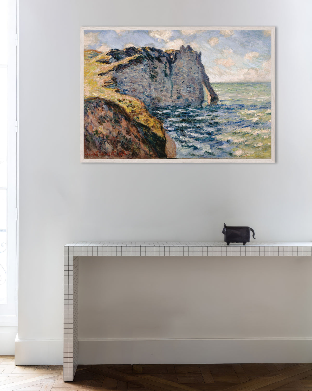 Poster of The Cliff of Aval, Étretat (1885) by Claude Monet, with white wooden frame