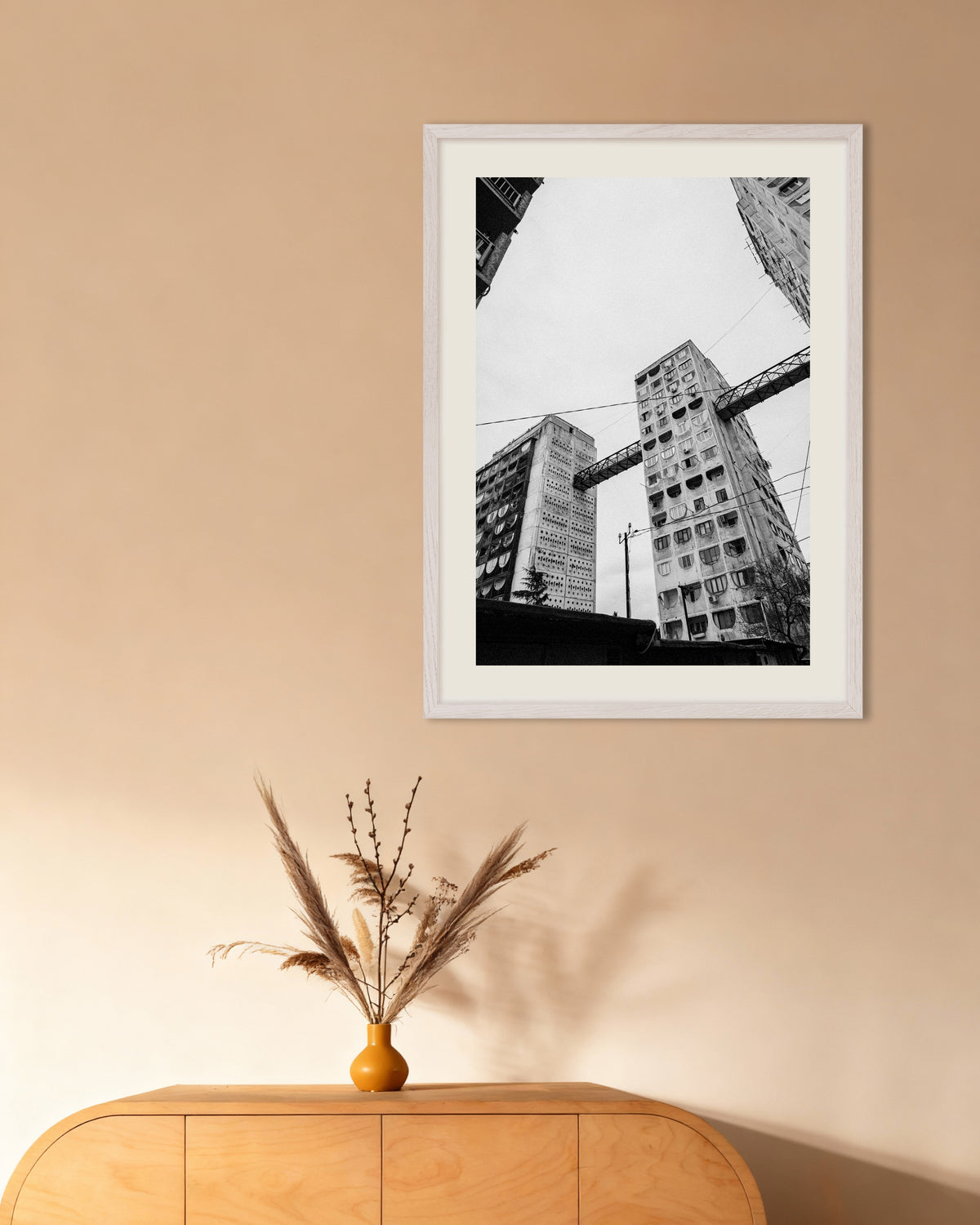 Poster of Towers Linked by Bridges From Below, with white wooden frame